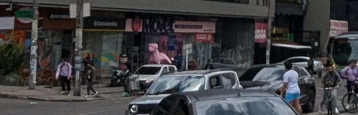 cropped part of the photo, showing a few shops along a street